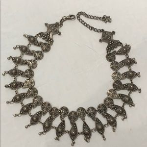 Belt that adjusts from 29” to 38”.